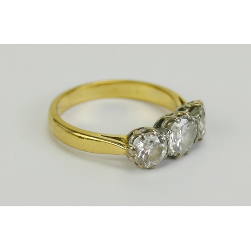 1 - A Three Stone Diamond Ring in a precious yellow metal setting, sold with a 1997 Bruford & Son insura... 