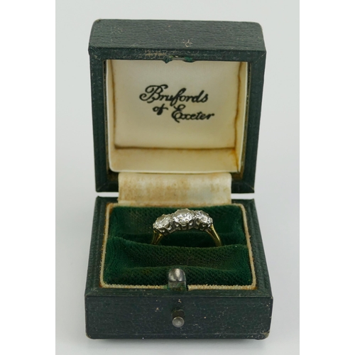 1 - A Three Stone Diamond Ring in a precious yellow metal setting, sold with a 1997 Bruford & Son insura... 