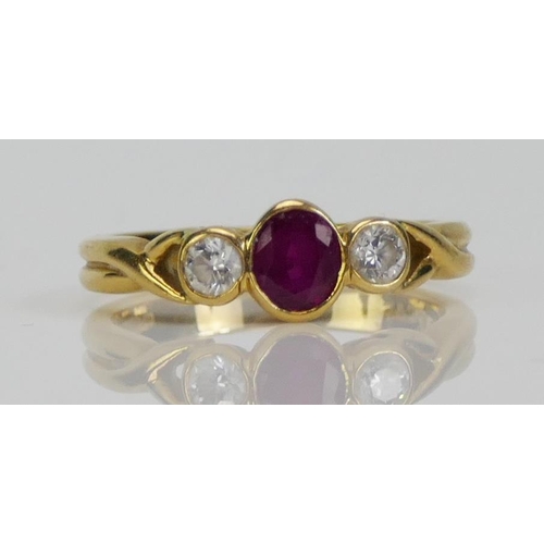 100 - An 18ct Gold, Ruby and Diamond Ring, c. 4.67x4.24mm principal rub over set stone, c. 2.7mm brilliant... 