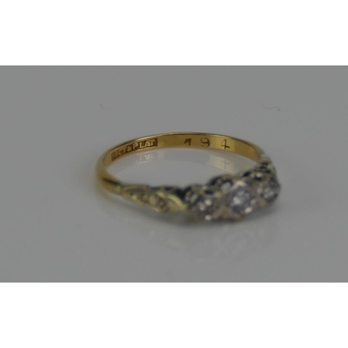 101 - An 18ct Gold and Diamond Three Stone Ring, c. 2.4mm principal brilliant round cut illusion set in pl... 