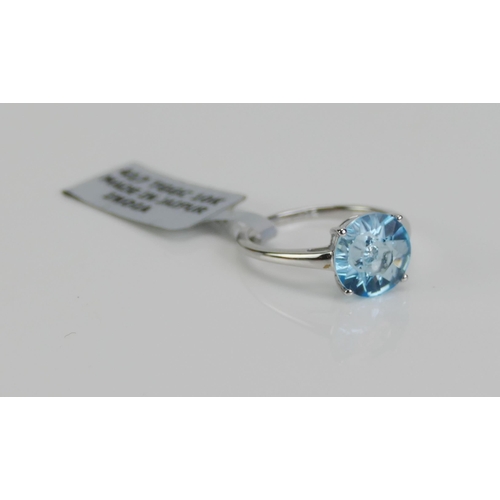 113 - A 10K White Gold and Blue Topaz Solitaire Ring, 10.15mm stone, size P.25, stamped 10K and 9ct gold h... 