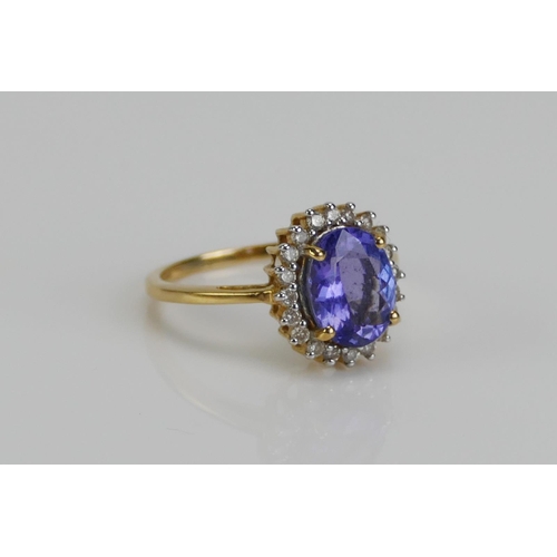 114 - An 18ct Gold, Tanzanite and Diamond Ring, 13.1x11.7mm head, size N, hallmarked, 3.83g