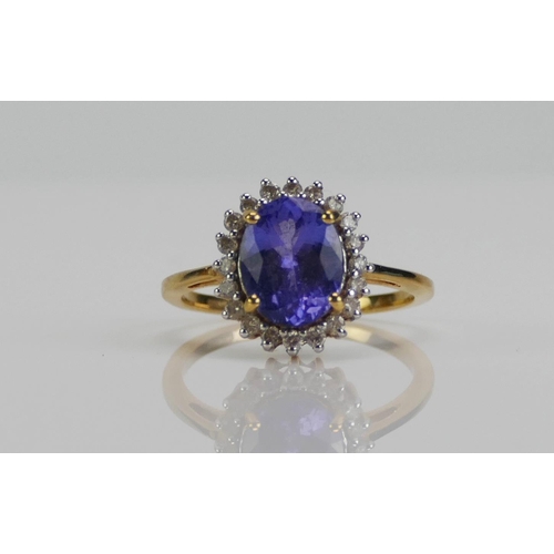 114 - An 18ct Gold, Tanzanite and Diamond Ring, 13.1x11.7mm head, size N, hallmarked, 3.83g