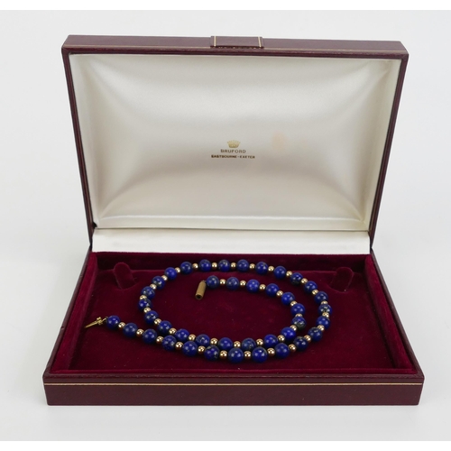 12 - A Precious Yellow Metal and Lapis Lazuli Necklace, 17.25