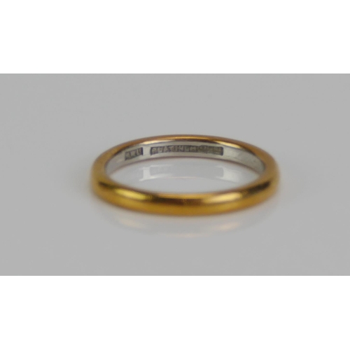 123 - A 22ct Gold and Platinum Wedding Band, inner band platinum, size K.25, 3.29g