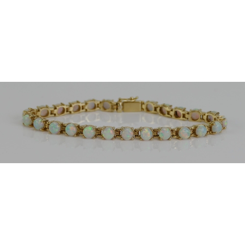 126 - An Opal Bracelet in a yellow metal setting, 7.5