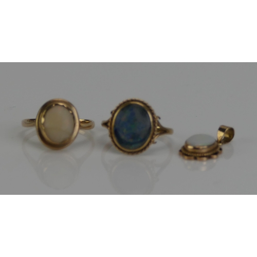 134 - A 9ct Gold and Opal Doublet Ring (size M.5, rubbed marks, 2.13g), another 9ct gold and opal ring (si... 