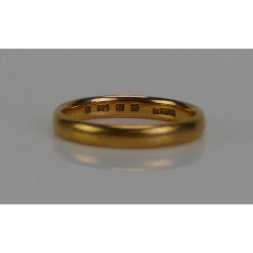 135 - A 22ct Gold Plain Wedding Band, 3.1mm wide, size K.5, London 1930, 3.38g