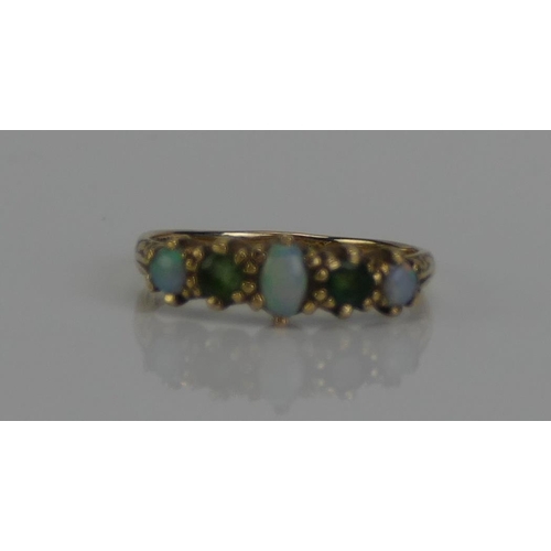 136 - An Opal and Gem Set Five Stone Ring in a precious yellow metal setting, marks dirty, KEE tests as 9c... 