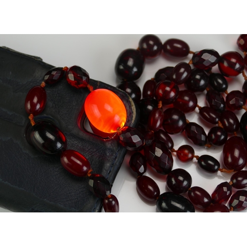 147 - A Selection of Faux Cherry Amber, largest bead 24.4x18.8mm, 126g