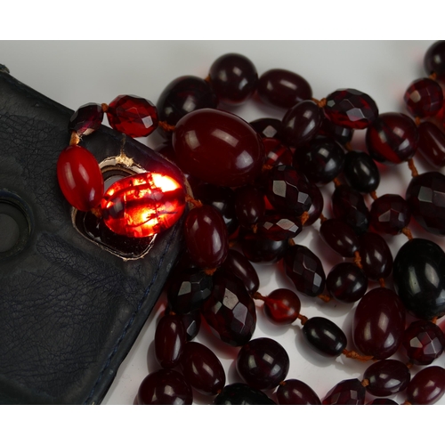 147 - A Selection of Faux Cherry Amber, largest bead 24.4x18.8mm, 126g