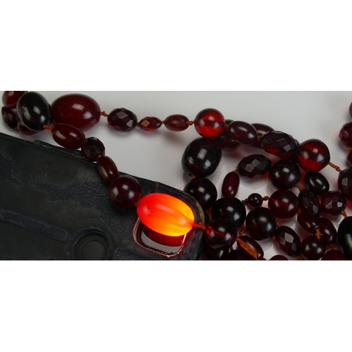 147 - A Selection of Faux Cherry Amber, largest bead 24.4x18.8mm, 126g