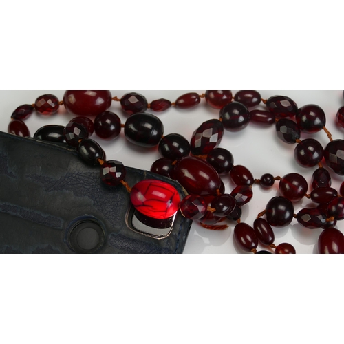 147 - A Selection of Faux Cherry Amber, largest bead 24.4x18.8mm, 126g