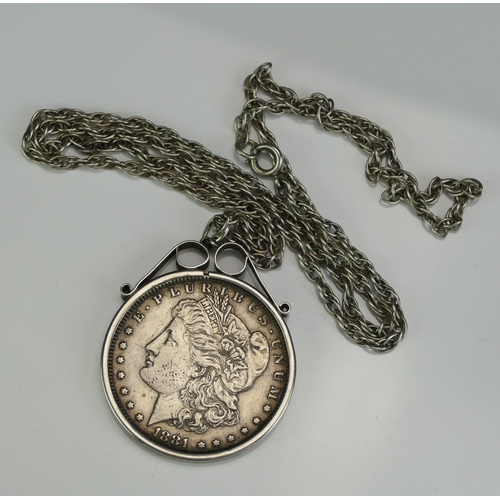 148 - A US 1881 Morgan Dollar in a silver pendant mount and chain, 42.56g