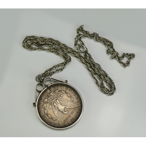 148 - A US 1881 Morgan Dollar in a silver pendant mount and chain, 42.56g