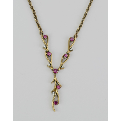 15 - A 9K Gold, Ruby and Diamond Necklace, 56mm wide central element, 30mm drop, stamped 375 9K, 7.73g