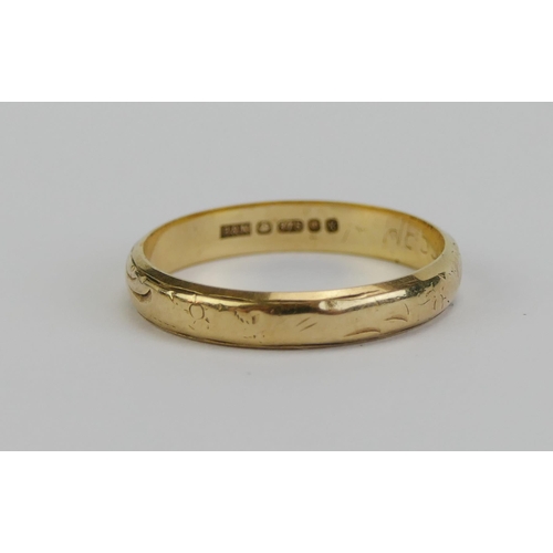 18 - A 9ct Gold Wedding Band with chased decoration, 3.3mm wide, size N.25, London hallmarked, 1.87g