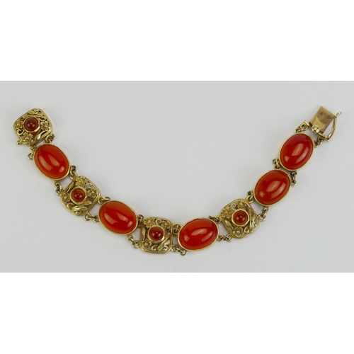 20 - A 9ct Gold and Carnelian Bracelet with foliate decorated panels, indistinct hallmarks, 6.75