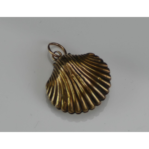 210 - An Antique Precious Yellow Metal Clam Shaped Memorial Locket containing a memento of platted hair, 2... 