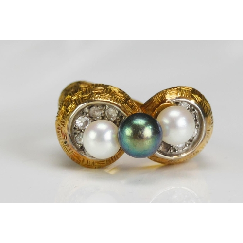 215 - A 1970's Pearl or Cultured Pearl and Diamond Ring in a high carat precious yellow metal setting a ce... 