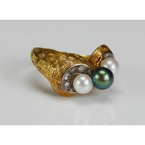 215 - A 1970's Pearl or Cultured Pearl and Diamond Ring in a high carat precious yellow metal setting a ce... 