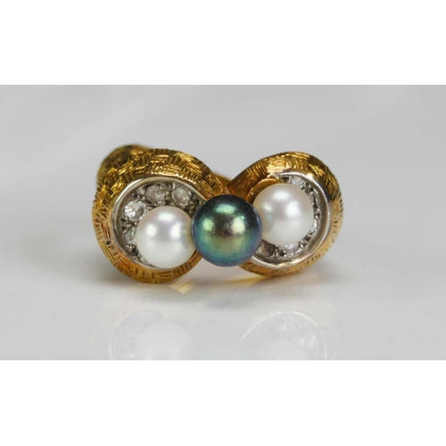 215 - A 1970's Pearl or Cultured Pearl and Diamond Ring in a high carat precious yellow metal setting a ce... 