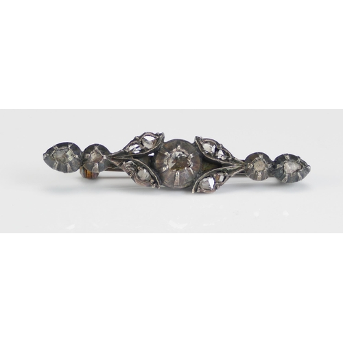 226 - A Rose Cut Diamond Foliate Bar Brooch in a precious white metal setting, 42.6mm, 4.51g