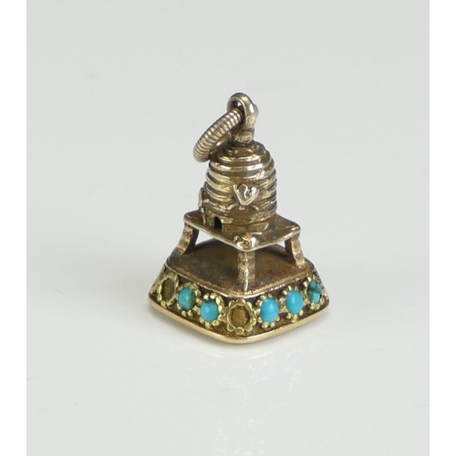 228 - A Georgian Precious Yellow Metal Beehive Fob decorated with turquoise and set with a carnelian matri... 