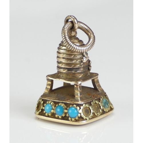 228 - A Georgian Precious Yellow Metal Beehive Fob decorated with turquoise and set with a carnelian matri... 