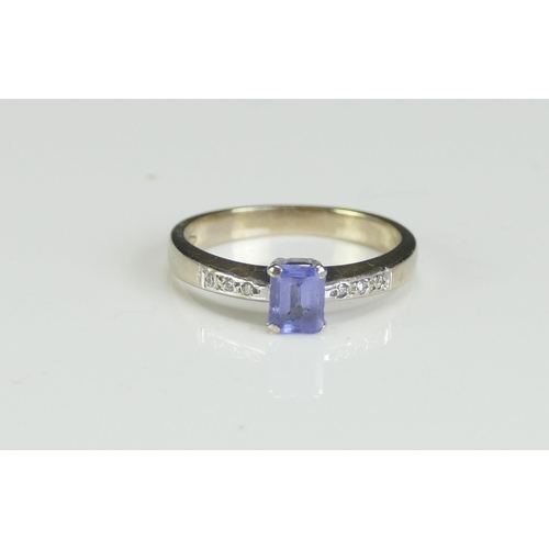 229 - An 18ct White Gold, Tanzanite and Diamond Ring, size K, stamped 750, 3.05g. Boxed and with original ... 