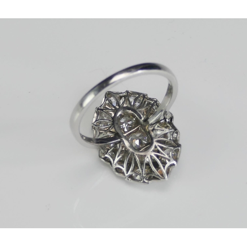 242 - An Art Deco18ct White Gold and Diamond Plaque Ring, c. 4.25x4mm largest old cut millegrain set, size... 