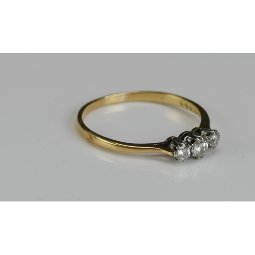 243 - An 18ct Gold and Diamond Three Stone Ring, 3.1mm principal platinum set stone, size S.5, stamped PLA... 