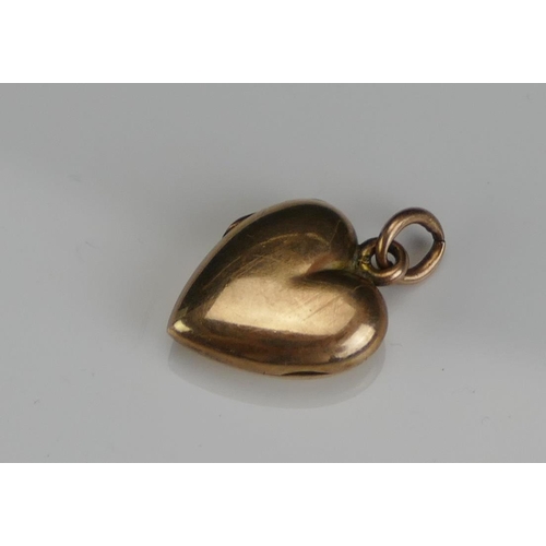 253 - An Antique 9ct Gold Locket, 23.85mm drop, stamped 9CT, 3g