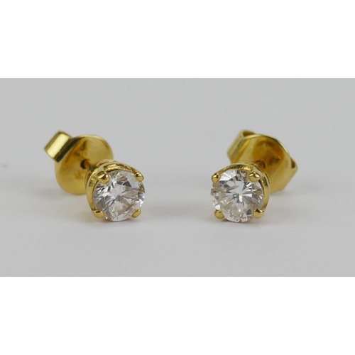 26 - A Pair of 18KT Gold and Diamond Stud Earrings, c. 4.55mm brilliant round cut stones, butterflies sta... 