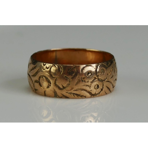 261 - A Victorian Wedding Band with chased foliate decoration, 7.37mm wide, size N.25, Chester 1899, 3.64g