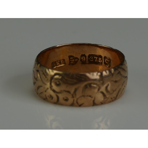 261 - A Victorian Wedding Band with chased foliate decoration, 7.37mm wide, size N.25, Chester 1899, 3.64g