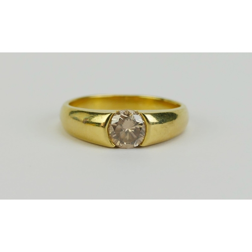 28 - A Diamond Solitaire Ring in a high carat precious yellow metal setting, 5.8mm brilliant round cut, s... 