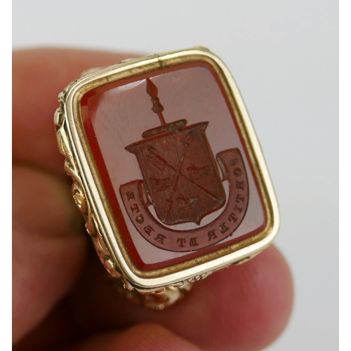 40 - A 19th Century Yellow Metal and Carnelian Fob Seal decorated with an armorial and Latin motto 