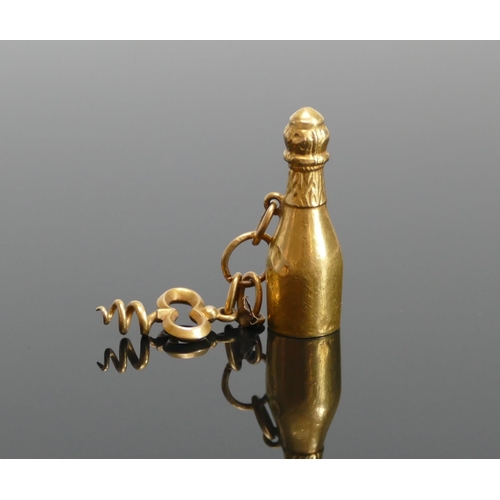 41 - An Antique 15ct Gold Champagne Bottle with corkscrew charm, 3.26g