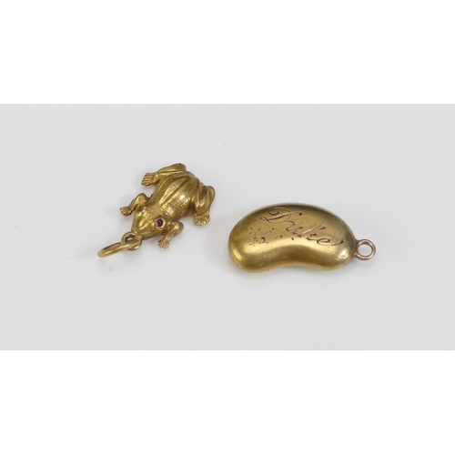 42 - An Antique 15ct Gold Frog Charm and a 'lucky bean' charm engraved 