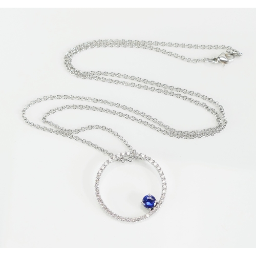 51 - An 18ct White Gold, Tanzanite and Diamond Pendant on chain, 23.9mm pendant etched 0.63 for total dia... 