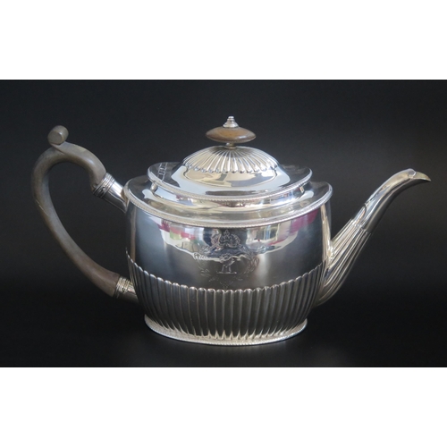 510 - A George III silver teapot, maker John Robins, London, 1800, crested, of oval form with half reeded ... 