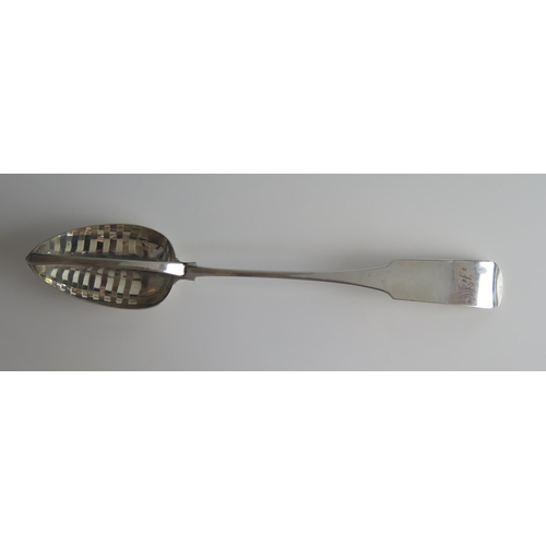 511 - A George III Irish silver Fiddle pattern straining spoon, maker John Power, Dublin, 1806, monogramme... 