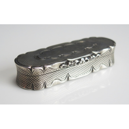 543 - A Victorian silver snuff box, maker Edward Smith, Birmingham, 1856, of oval form with engine turned ... 