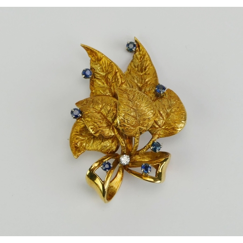 6 - A Sapphire and Diamond Foliate Spray Brooch in a high carat precious yellow metal setting, 43.1mm hi... 