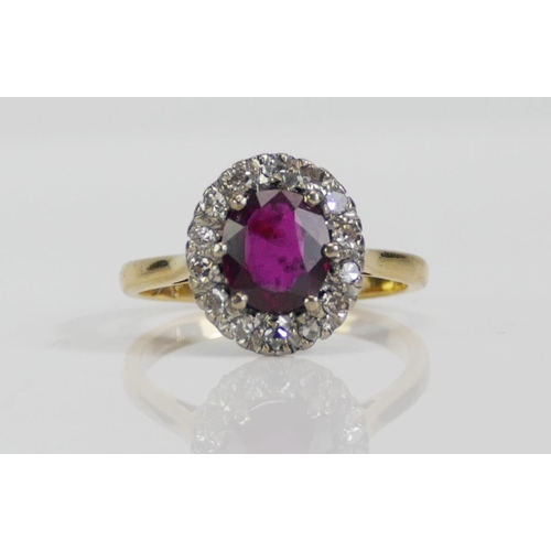 65 - An 18ct Gold, Ruby and Old Cut Diamond Cluster Ring, 7.4x6.5mm principal stone, 12.4x11.1mm head, si... 