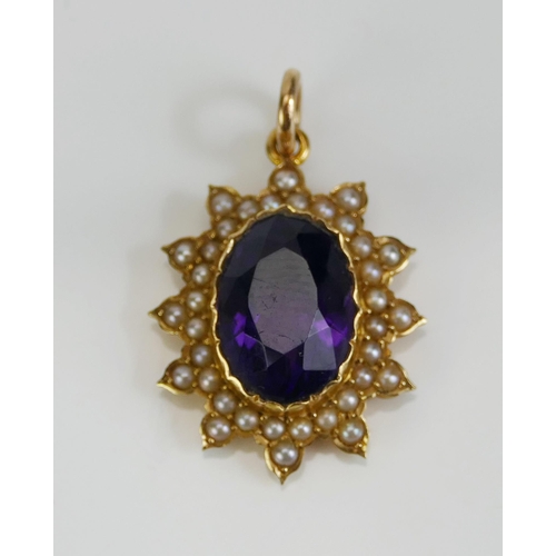 68 - An Amethyst and Seed Pearl Pendant in a precious yellow metal setting, c. 28.4mm drop, KEE tests as ... 