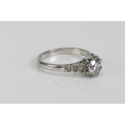 69 - An 18ct White Gold and Diamond Single Stone Ring with three millegrain set to each shoulder, 6.4mm p... 