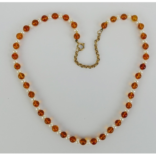 9 - A 9ct Gold, Amber and Freshwater Pearl Necklace, 19