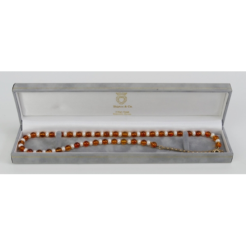 9 - A 9ct Gold, Amber and Freshwater Pearl Necklace, 19